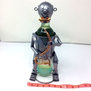 Mixed metal wine bottle holder.